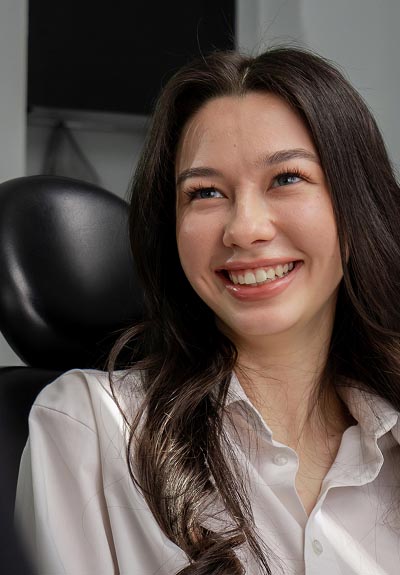 patient smiling during her visit to Taylor and Associates Family & Implant Dentistry