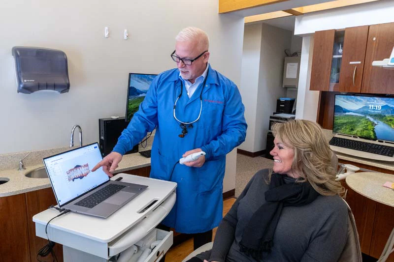 Dr. Taylor smiling at a patient as part of our preventive dentistry in Bay City, MI at Taylor And Associates.